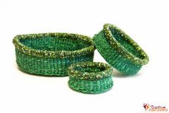 Set of green baskets with beads